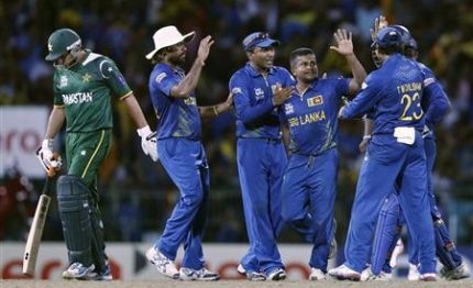 Sri Lanka's Herath celebrates with his teammates after he took the wicket of Pakistan's Afridi during their Twenty20 World Cup semi-final cricket match in Colombo